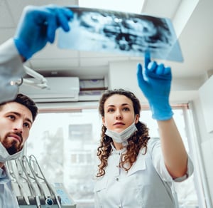 nurses looking at x-ray