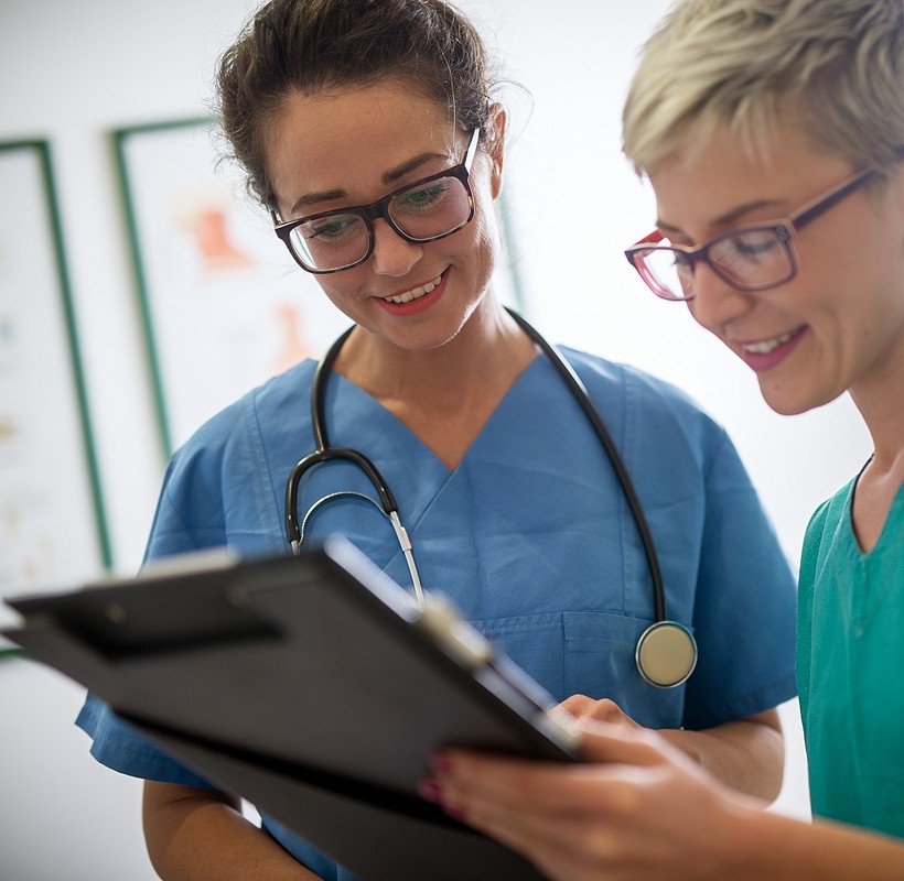 doctor and nurse reviewing notes